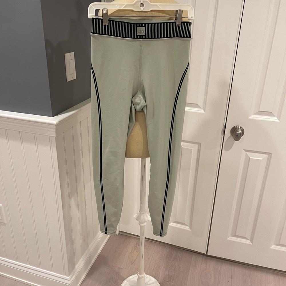 Alo Yoga Light Sage Green Athletic Leggings with Black Stripe Detail